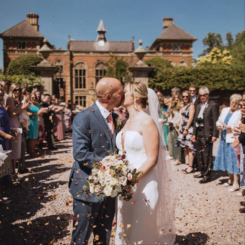 Bride with wedding flowers by Elimay's Flowers in Buckley, Flintshire